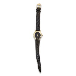 \"Gucci\" watch with a gold-colored case and a black leather strap.